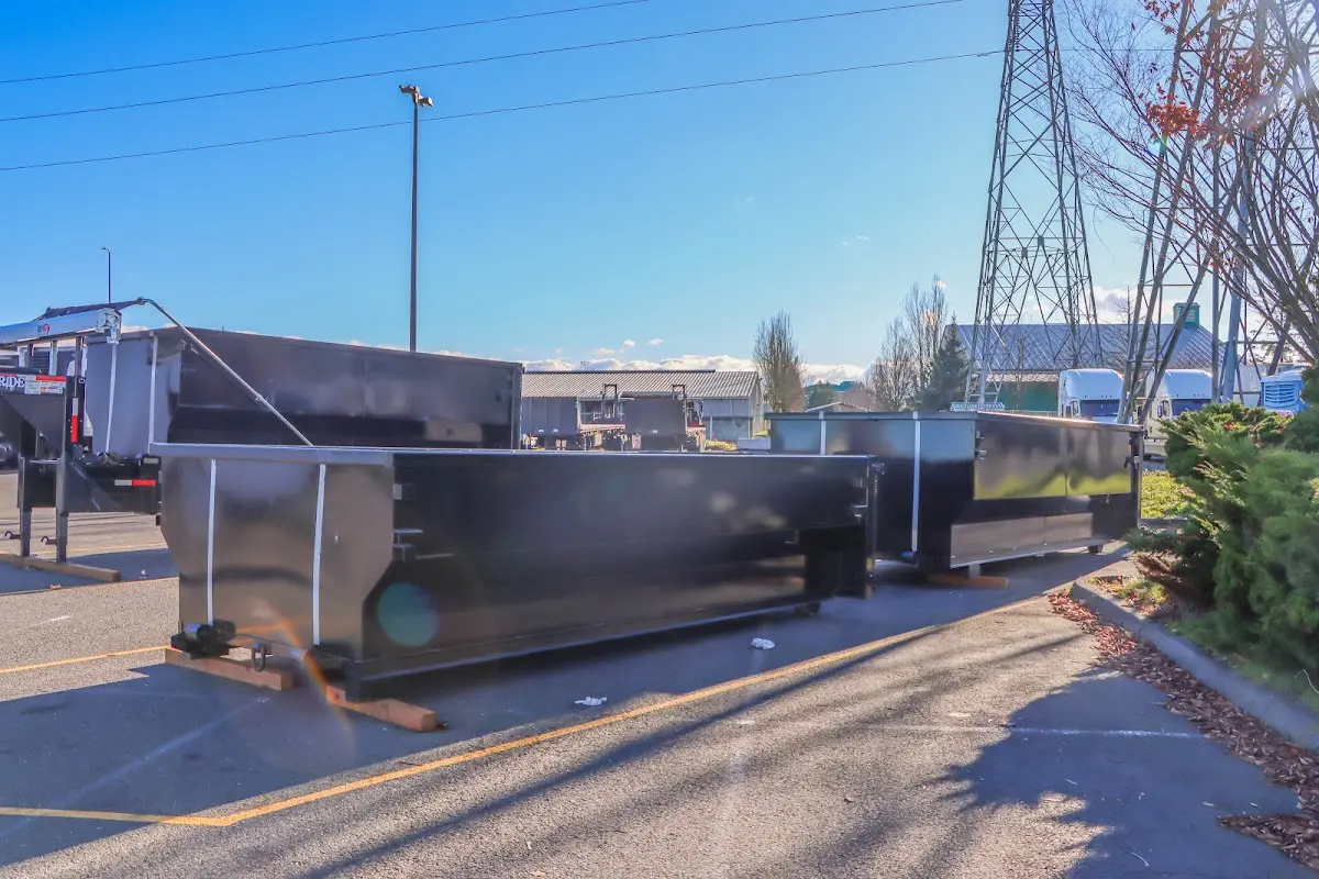 Roll-off dumpster ready for waste disposal at job site for Concrete Dumpster Rental in New Bedford